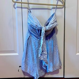 Blue romper made by Blue Blush. Size medium but runs on the smaller side.